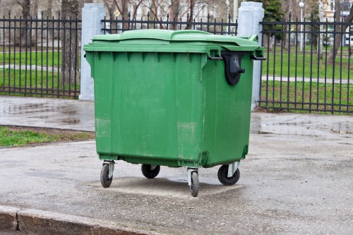 Waste collection trucks in Norbiton streets