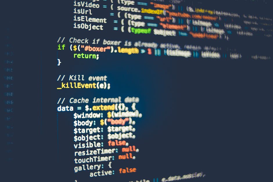 Close-up of a MacBook Pro laptop screen displaying a dark-themed code editor with JavaScript and React code, including an image tag with a 'reactLogo' class and an 'alt' text of 'React logo'. The code
